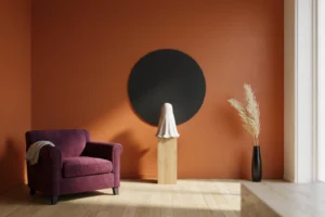 Modern Halloween wall décor with a burnt orange wall, black circle and white ceramic ghost